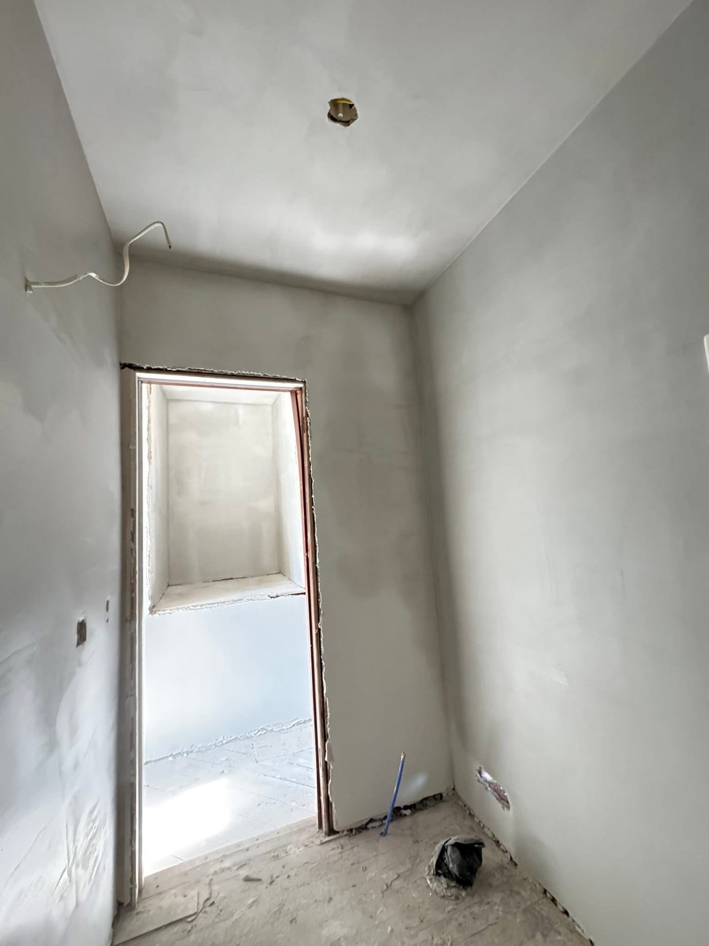 Drywall installation around electrical wiring