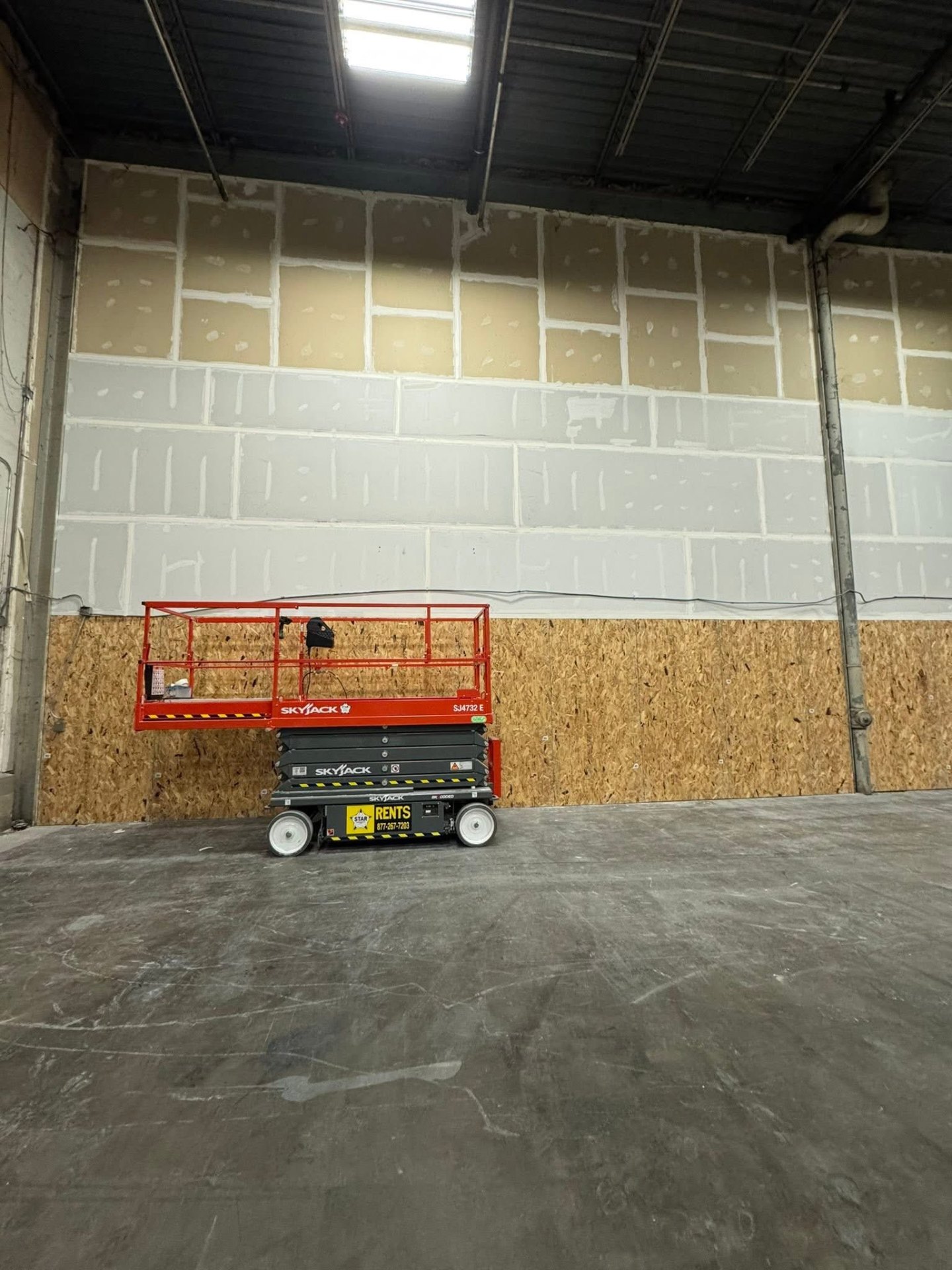 Commercial drywall work from warehouse lift